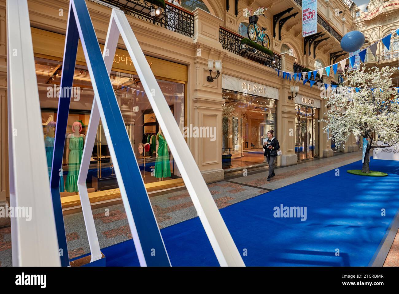 Woman walk by Gucci shop in GUM department store. Moscow, Russian  Federation Stock Photo - Alamy