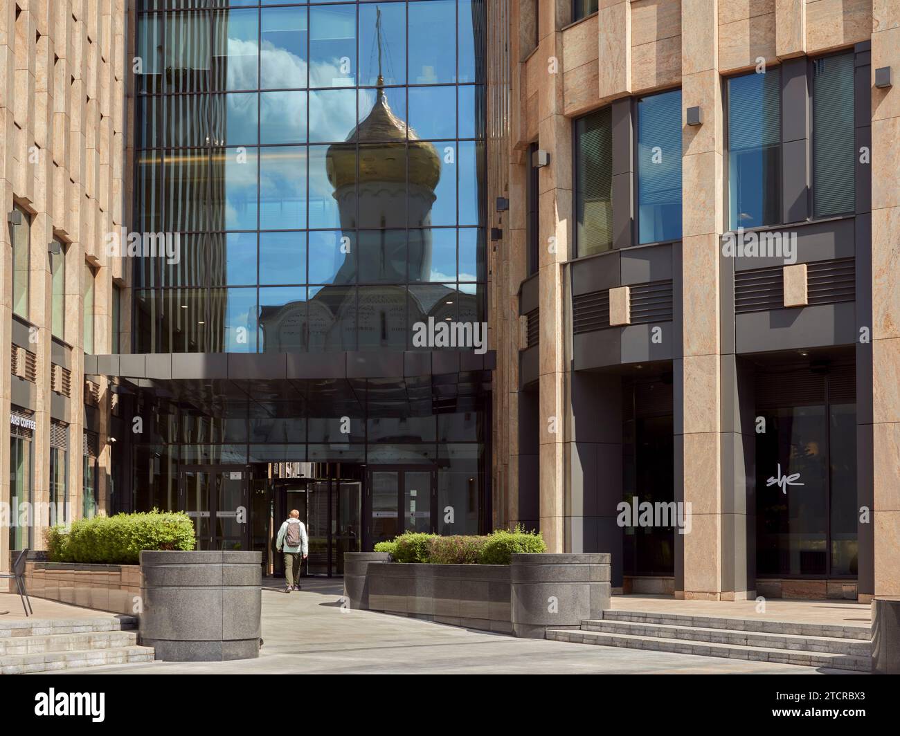 Church of Saint Nicholas at Tverskaya Zastava reflected in windows of a modern business center. Moscow, Russia. Stock Photo