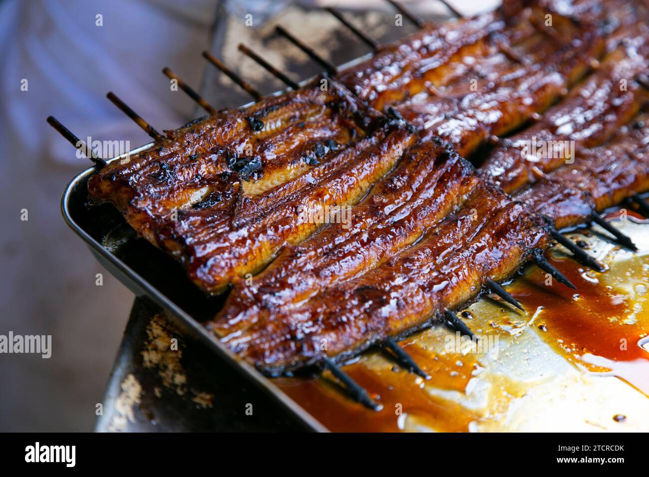 Grilled smoked eel is the most traditional food in Narita, Chiva, Japan. Stock Photo