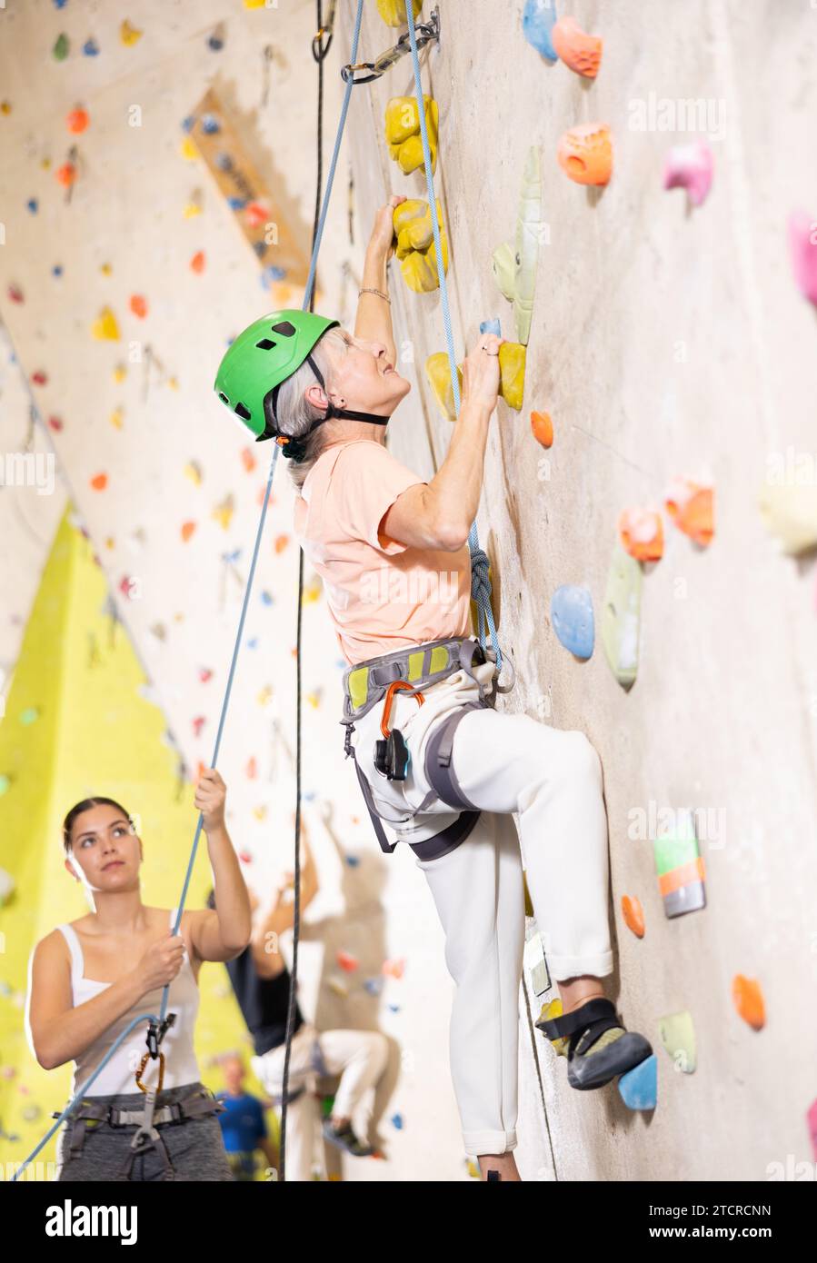 Older woman climbing hi-res stock photography and images - Alamy