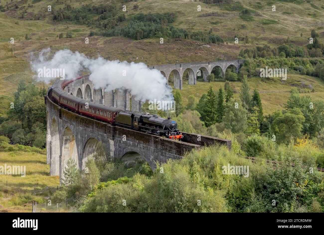 Steam Train and Glenfinnan viaduct in the Scottish Highlands. Famous train bridge used in TV and