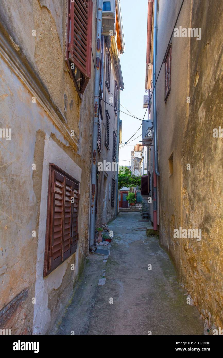 An alley in the Stari Grad historic centre of the coastal town of Novi Vinodolski, Primorje-Gorski Kotar County, Croatia Stock Photo