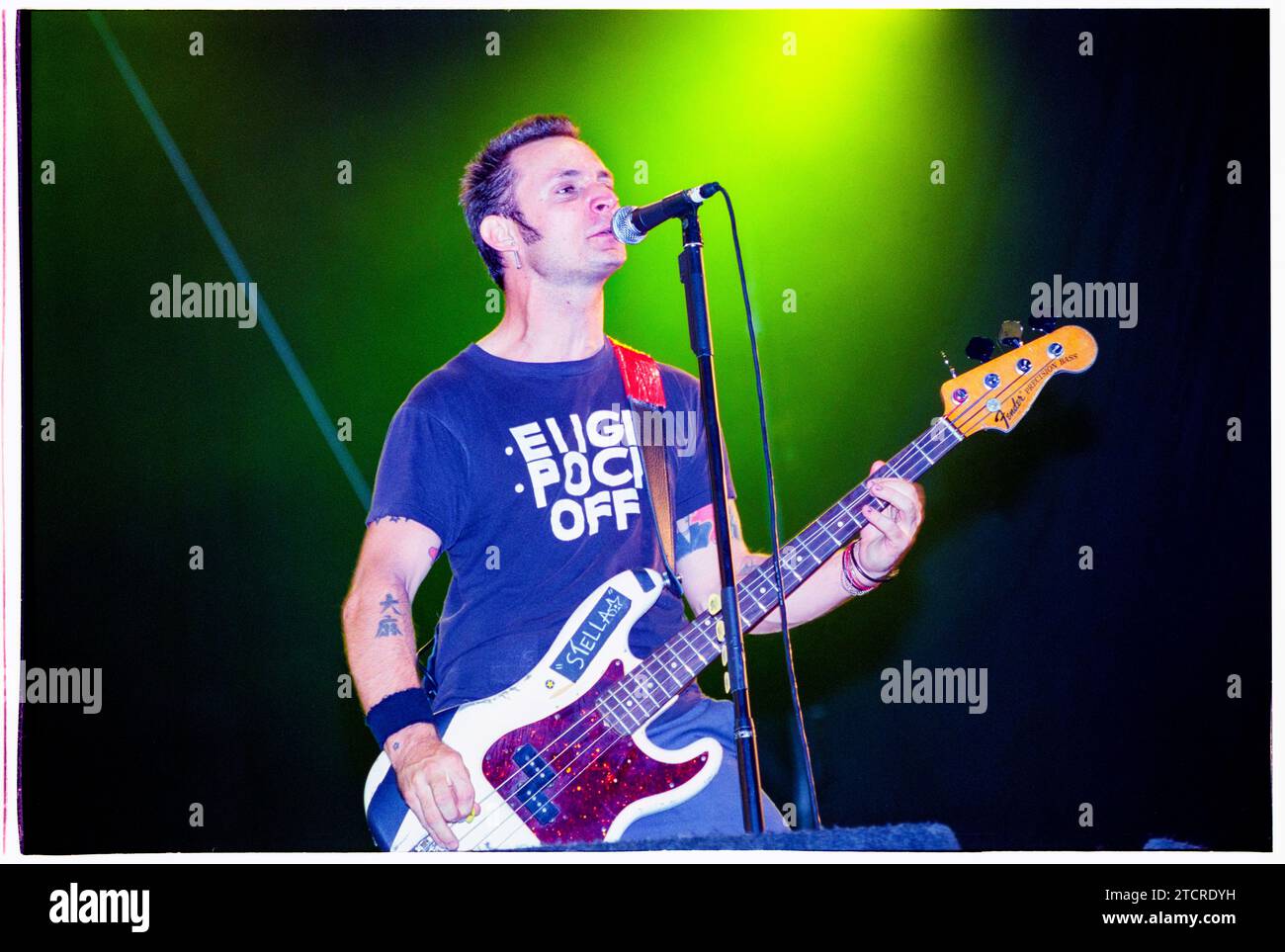 MIKE DIRNT, ARMSTRONG, GREEN DAY, READING FESTIVAL, 2001: Mike Dirnt bass  player of American punk rock band Green Day plays the Main Stage at Reading  Festival, Reading, England on 24 August 2001.