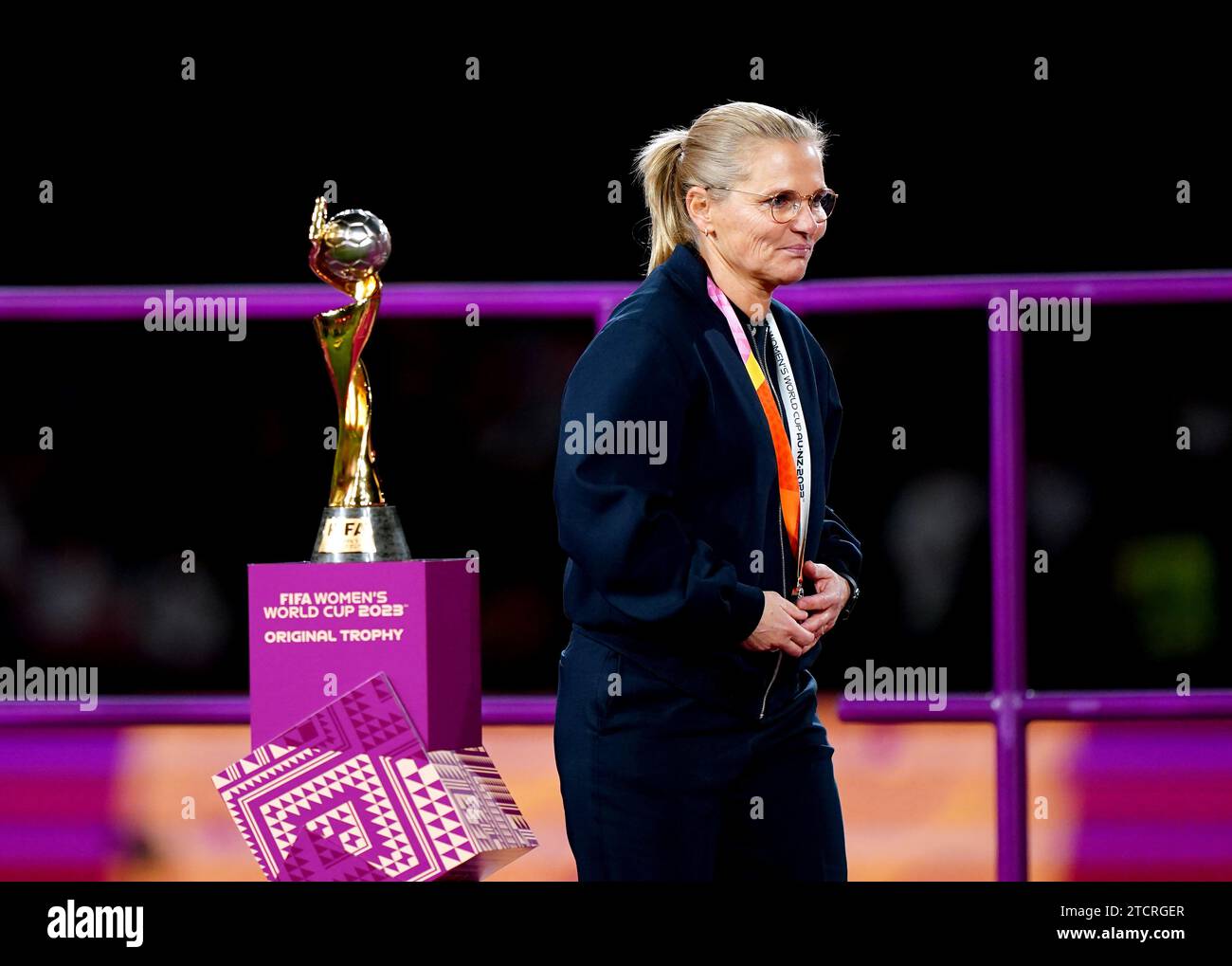 File photo dated 20-08-2023 of England head coach Sarina Wiegman walks past the trophy after being presented with her runner up medal at the end of the FIFA Women's World Cup final match at Stadium Australia, Sydney. Sarina Wiegman's team overcame Lauren James' red card to edge past Nigeria on penalties before seeing off Colombia and hosts Australia but, despite the heroics of Mary Earps in goal, Spain proved too strong, with Olga Carmona scoring the only goal in the final. Issue date: Thursday December 14, 2023 Stock Photo