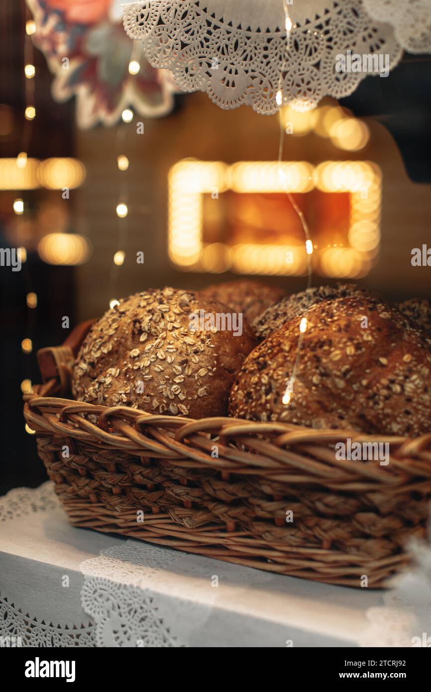 Fresh multigrain bread in a wicker basket in a baked goods store Stock Photo