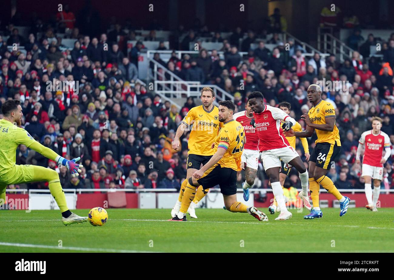 File photo dated 02-12-2023 of Arsenal's Bukayo Saka scores the opening goal of the game during the Premier League match at the Emirates Stadium, London. Arsenal opened up a four-point lead at the top of the Premier League as two early goals proved just enough to see off Wolves 2-1 at the Emirates Stadium. Issue date: Thursday December 14, 2023. Stock Photo