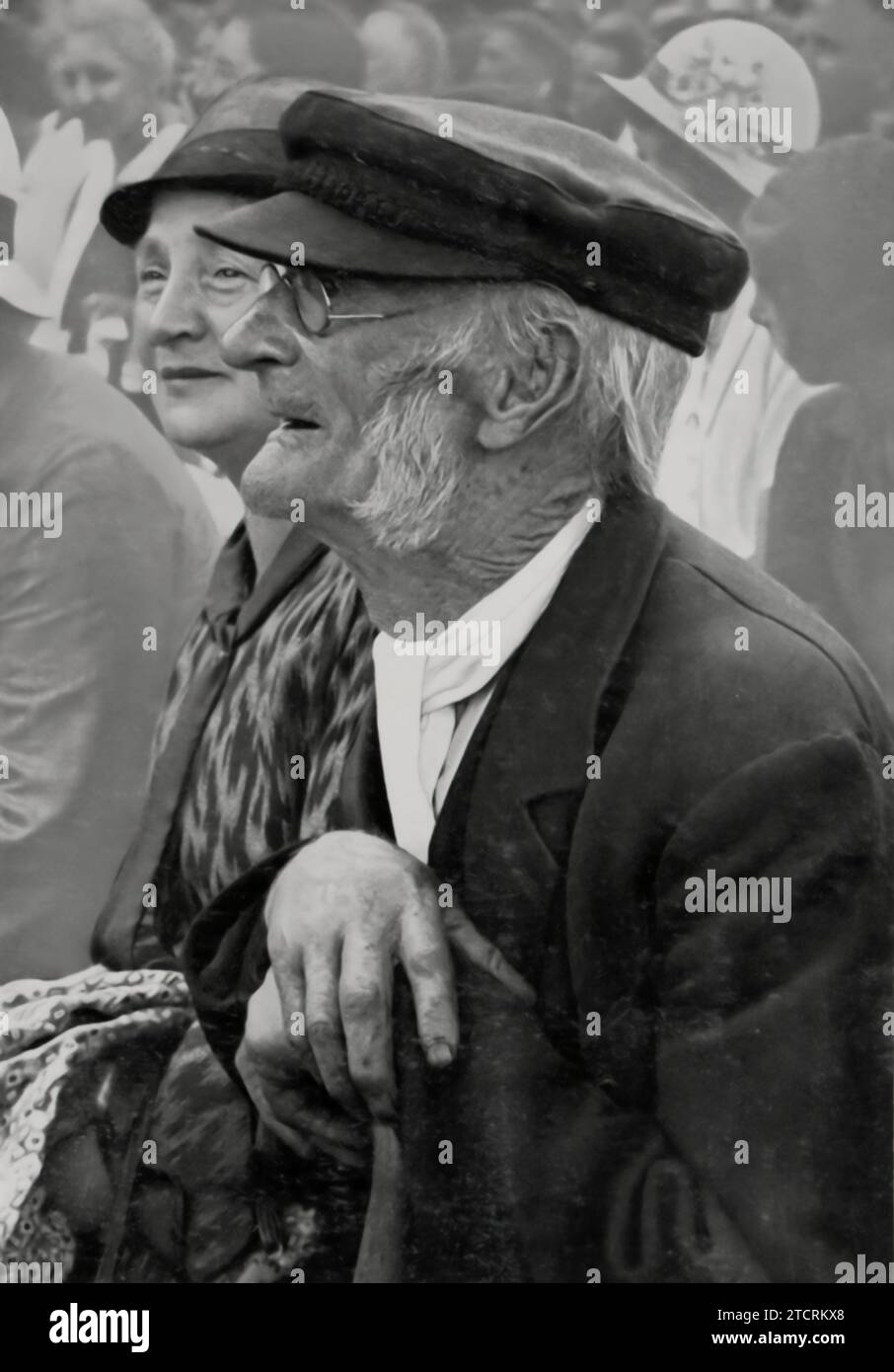 In this 1932 election campaign image from Hesse, an elderly man is depicted, representing the involvement and interest of older generations in the tumultuous political landscape of the time. The photograph, taken during a critical moment in the rise of the Nazi Party, captures the engagement of various societal groups, including senior citizens, in the political process. Adolf Hitler may not be present in the image, but the scene reflects the widespread reach and impact of the party's propaganda and campaigning efforts, even among the elderly population. Stock Photo