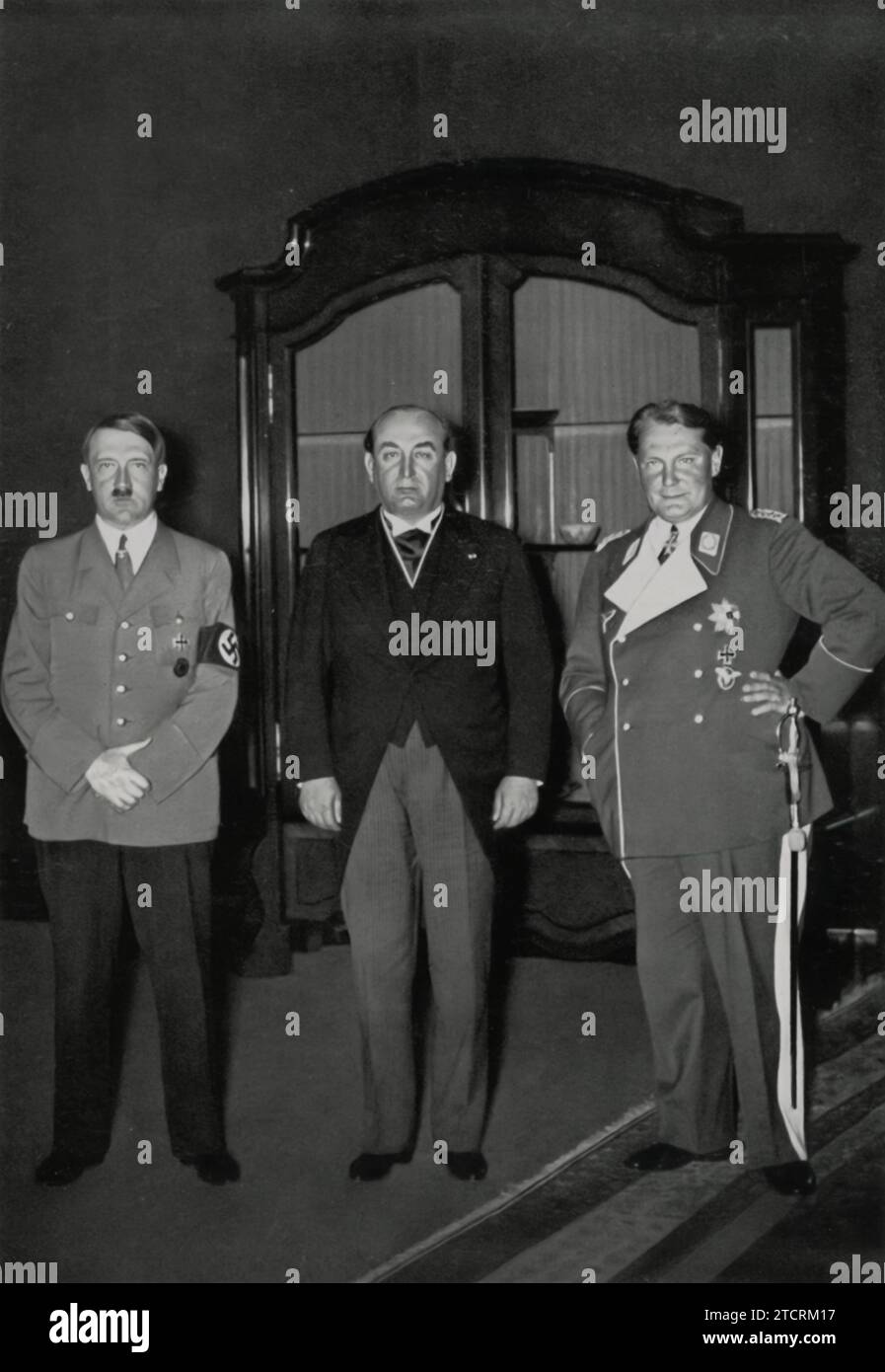 Adolf Hitler is shown during a visit to the Reich Chancellery, meeting with Prime Minister Gombos. This event highlights a diplomatic encounter, reflecting the interactions of the Nazi regime with foreign political leaders. The Reich Chancellery, as the site of this meeting, signifies the formal and political nature of such engagements. These meetings were part of the regime's foreign policy efforts, and the presence of international leaders like Prime Minister Gombos underscores the diplomatic activities and alliances during Hitler's leadership. Stock Photo