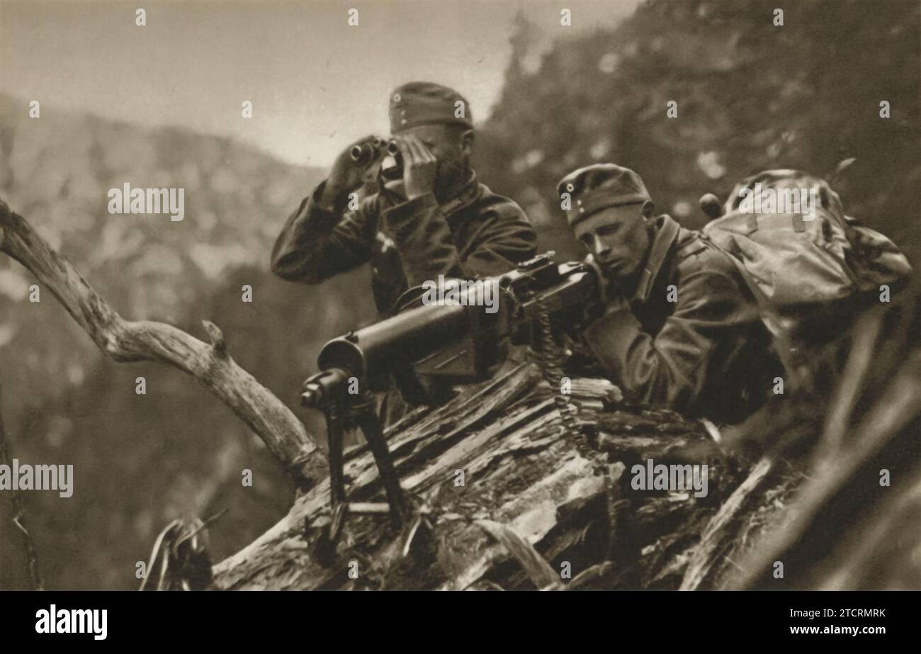 A typical German LMG (Light Machine Gun) nest is strategically positioned on top of a steep slope. In this setup, one soldier takes on the role of the spotter, keeping a keen eye out for targets and potential threats, while the other operates the machine gun. This arrangement showcases the teamwork essential in such operations, combining observational skills with firepower. Stock Photo