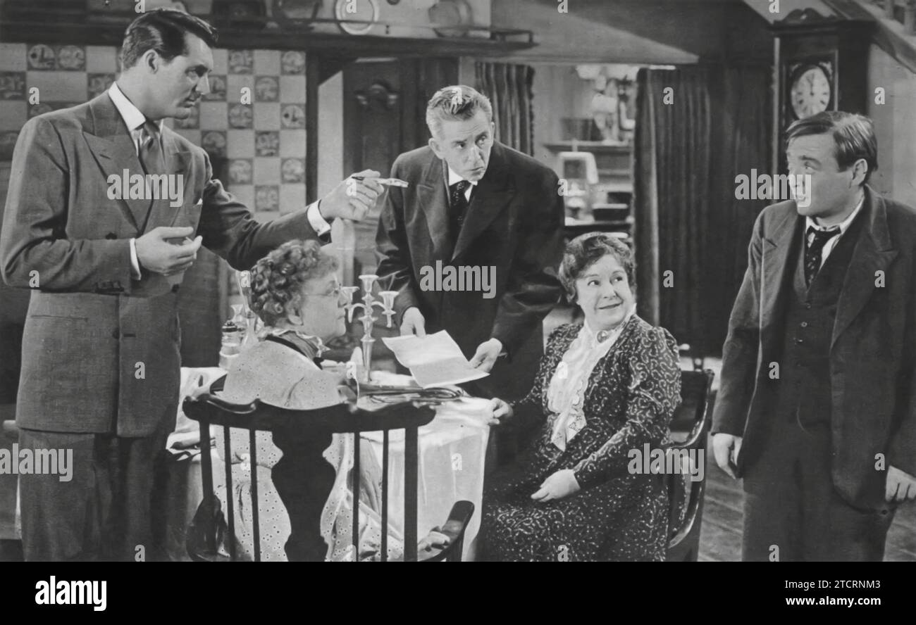 Cary Grant, Jean Adair, Edward Everett Horton, Josephine Hull, and Peter Lorre star in the dark comedy 'Arsenic and Old Lace' (1944). Grant finds himself entangled in a web of comedic chaos involving his eccentric aunts, played by Adair and Hull, while Horton and Lorre add to the film's quirky charm. Stock Photo