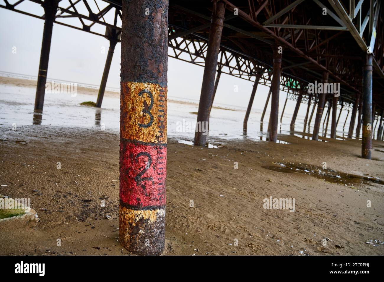 Graduated markings on leg of St Annes Pier Stock Photo Alamy