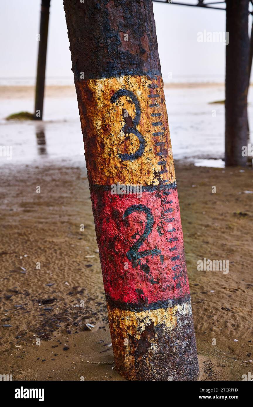 Graduated markings on leg of St Annes Pier Stock Photo Alamy