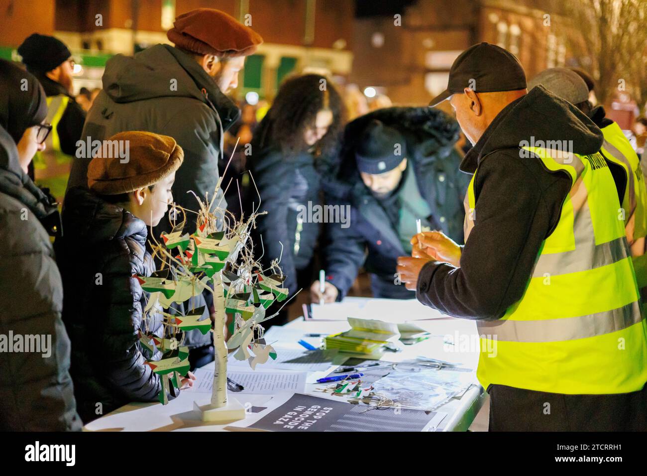 Palestine demonstration outide Nuneaton Town Hall. People gathered in Nuneaton Town Centre in support of the Palestine people. Six small wooden coffins were on display to represent the many children killed in the conflict with Israel. The meeting was peacefull. Stock Photo