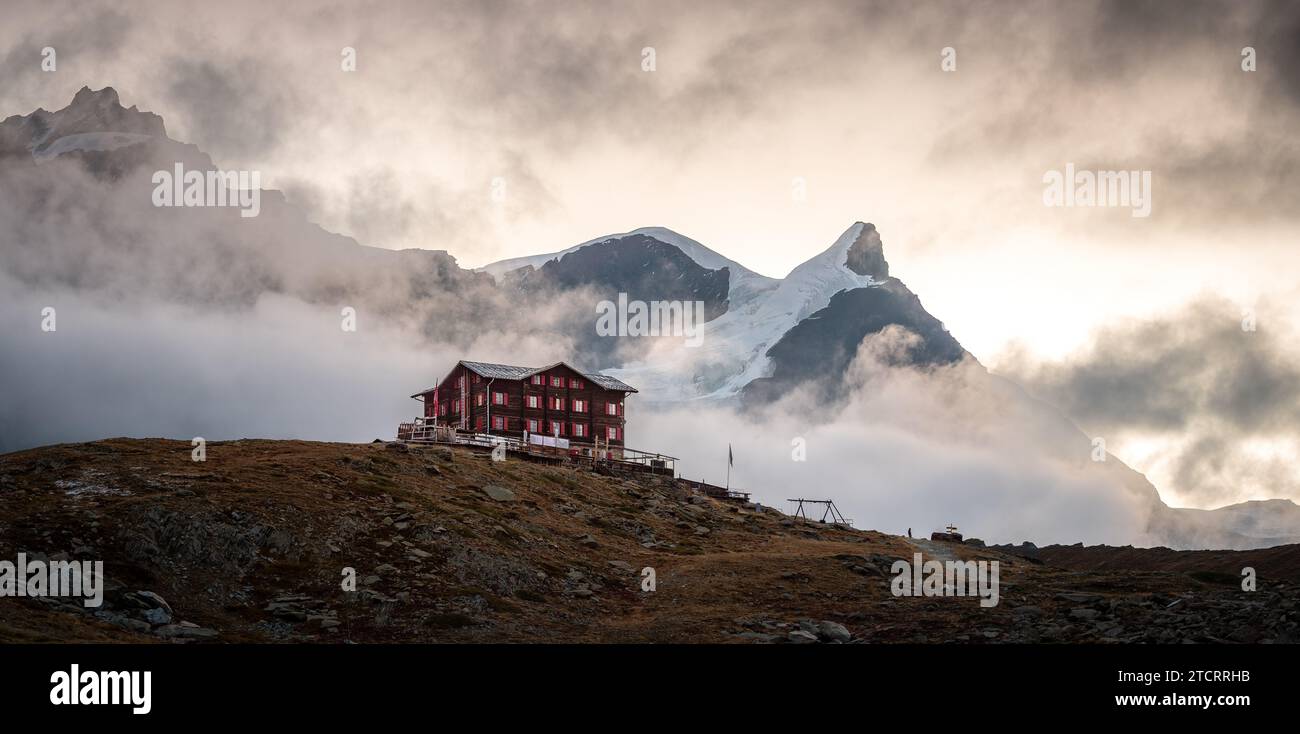 Autumn scene in Zermatt. Old hotel and mount Adlerhorn. Valais Canton of Switzerland. Stock Photo