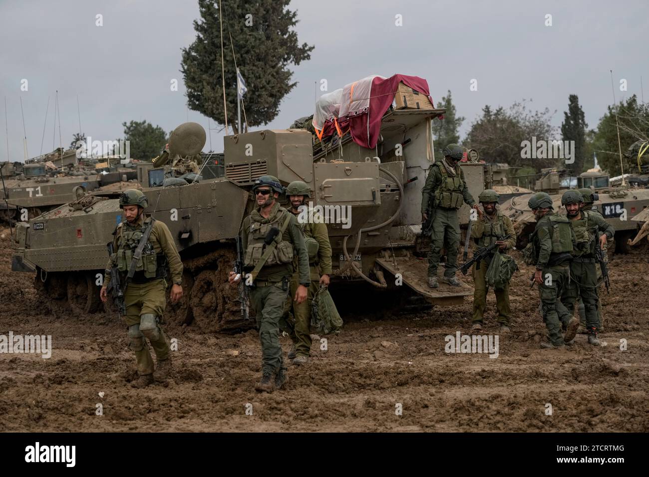 Israeli soldiers are seen at a staging area near the Israeli-Gaza border, in southern Israel, Thursday, Dec. 14, 2023. The army is battling Palestinian militants across Gaza in the war ignited by Hamas' Oct. 7 attack into Israel. (AP Photo/Leo Correa) Stock Photo