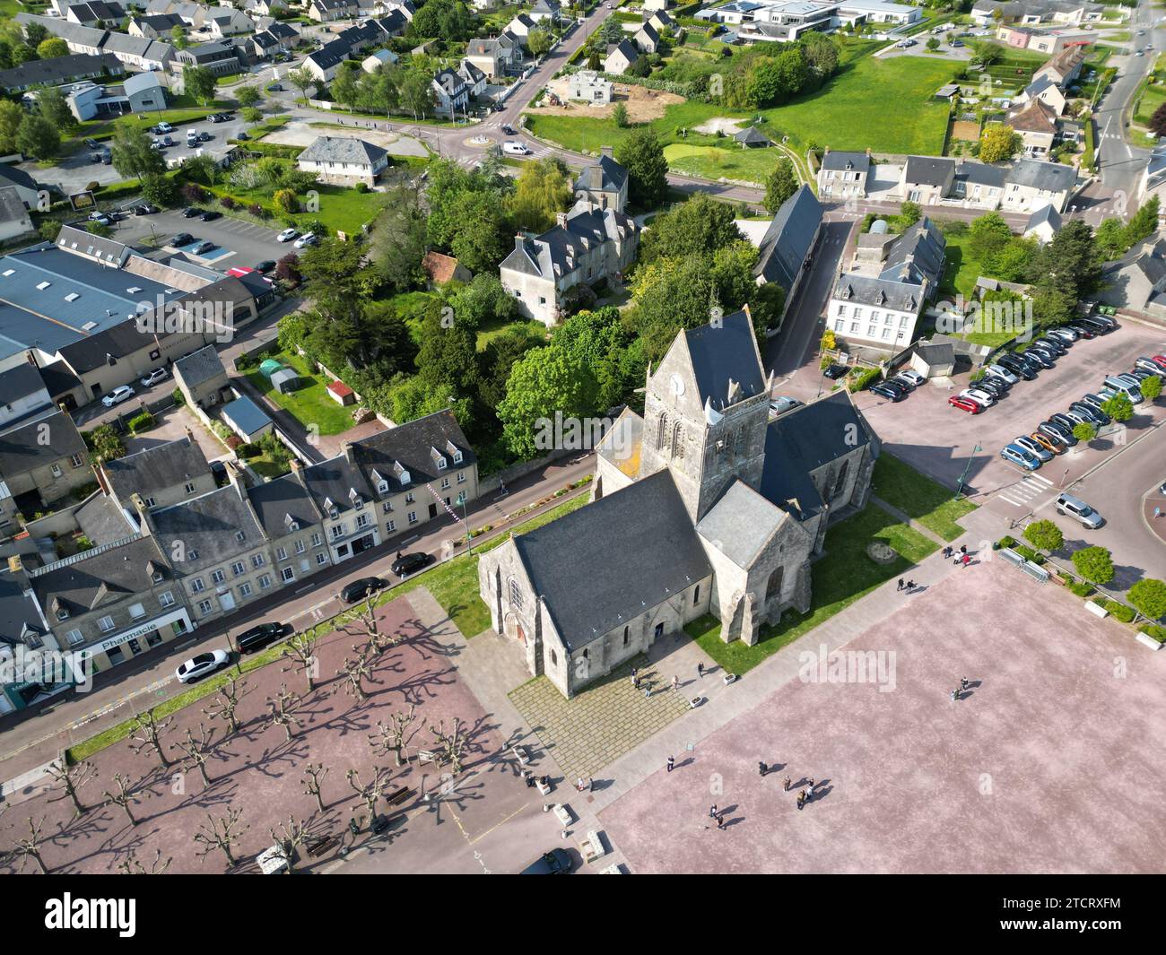 Sainte Mere Eglise Normandy France Overhead birds eye drone aerial view  of church Stock Photo