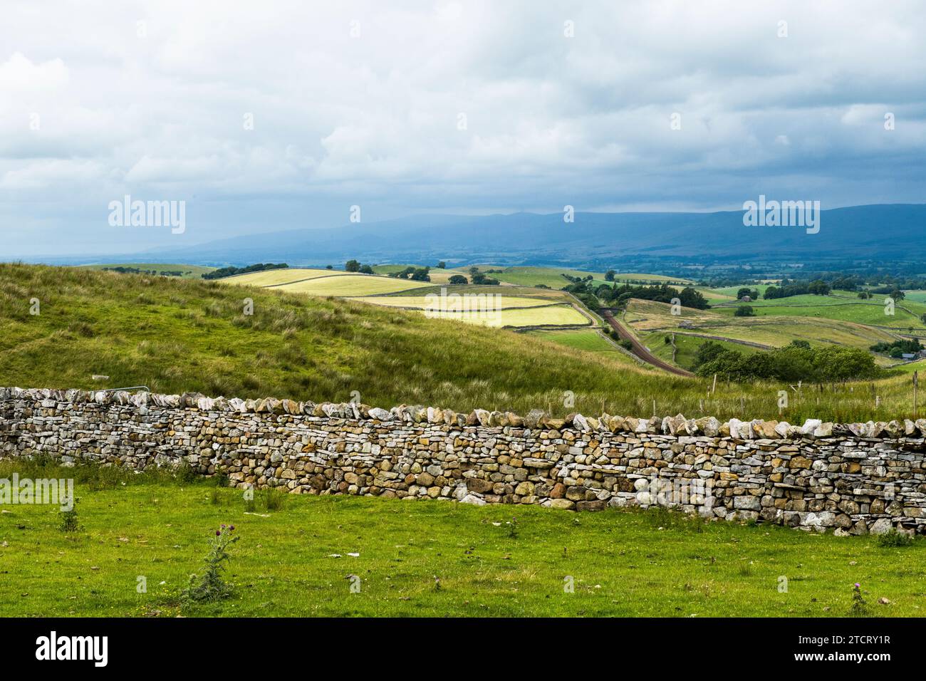 View across to the Pennines from the Tommy Road in Cumbria in July with a stunning view inbetween the two. Stock Photo