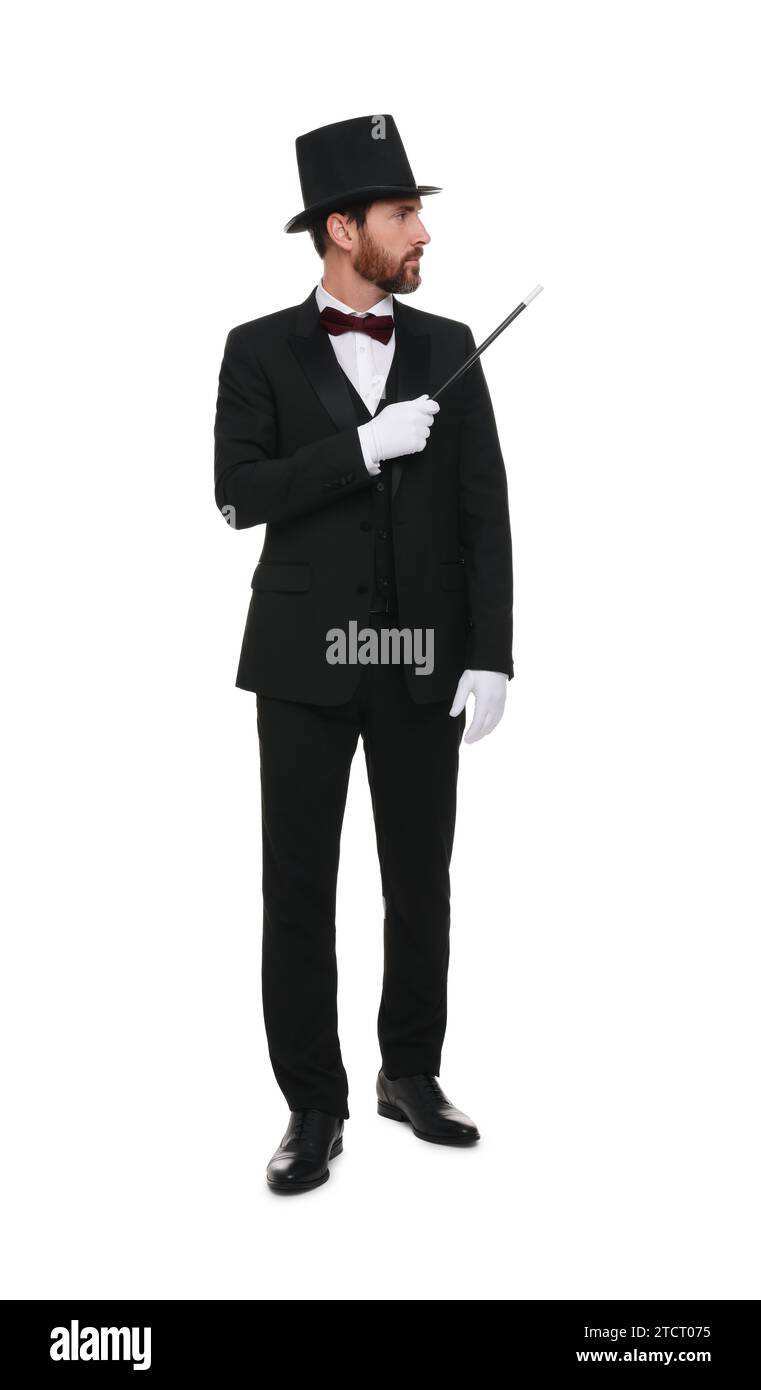 Magician in top hat holding wand on white background Stock Photo - Alamy