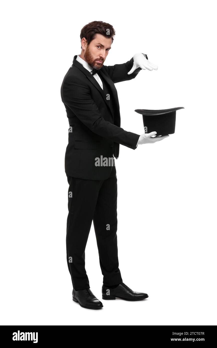 Magician showing magic trick with top hat on white background Stock ...
