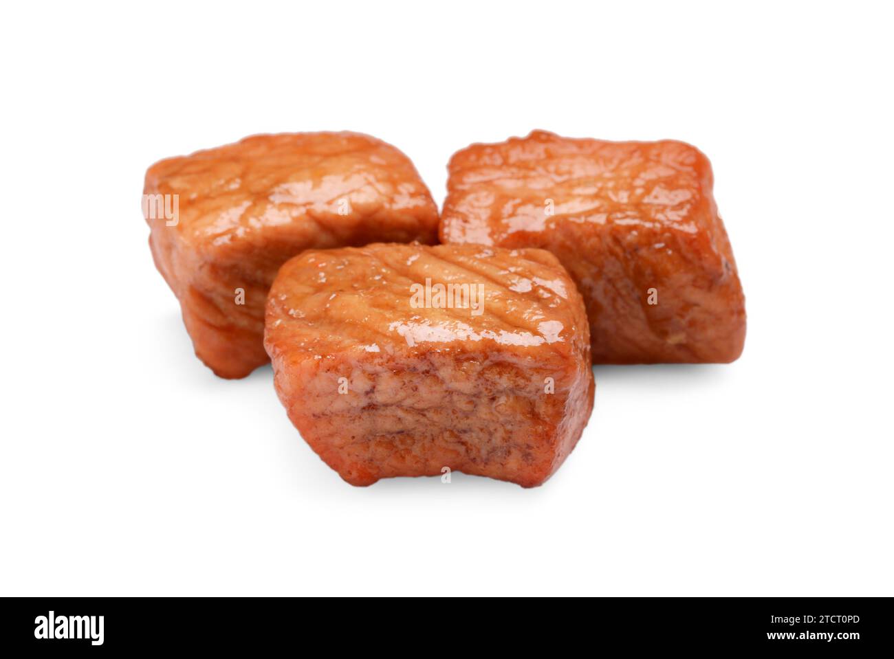 Pieces of delicious cooked beef isolated on white. Tasty goulash Stock Photo