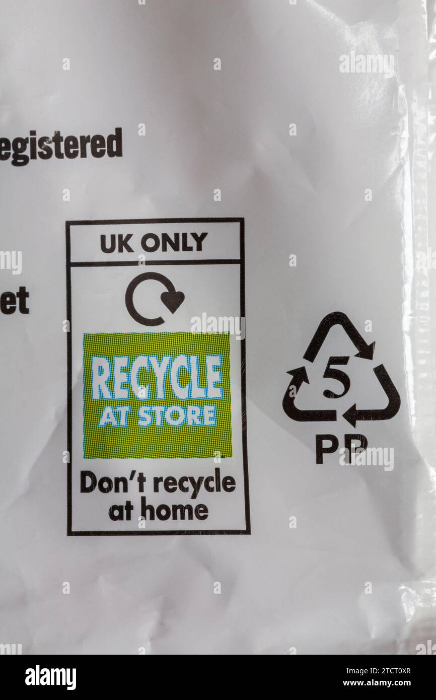 Recycle at store don't recycle at home - recycling information on multipack of Walkers sweet & spiced Christmas Pudding flavour crisps Stock Photo