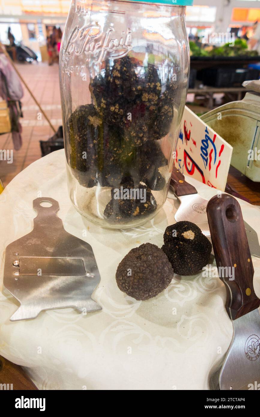 Display including truffles in a jar and truffle slicer / cutter for