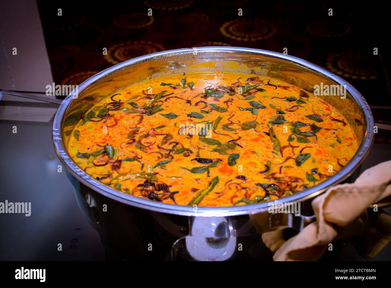 Home made long beans and potato cooked in coconut milk curry Stock