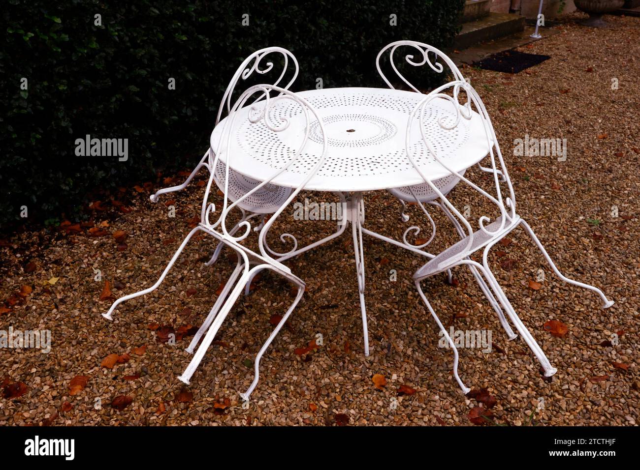 A Metal Set of a Garden Table and Four Chairs. Stock Photo