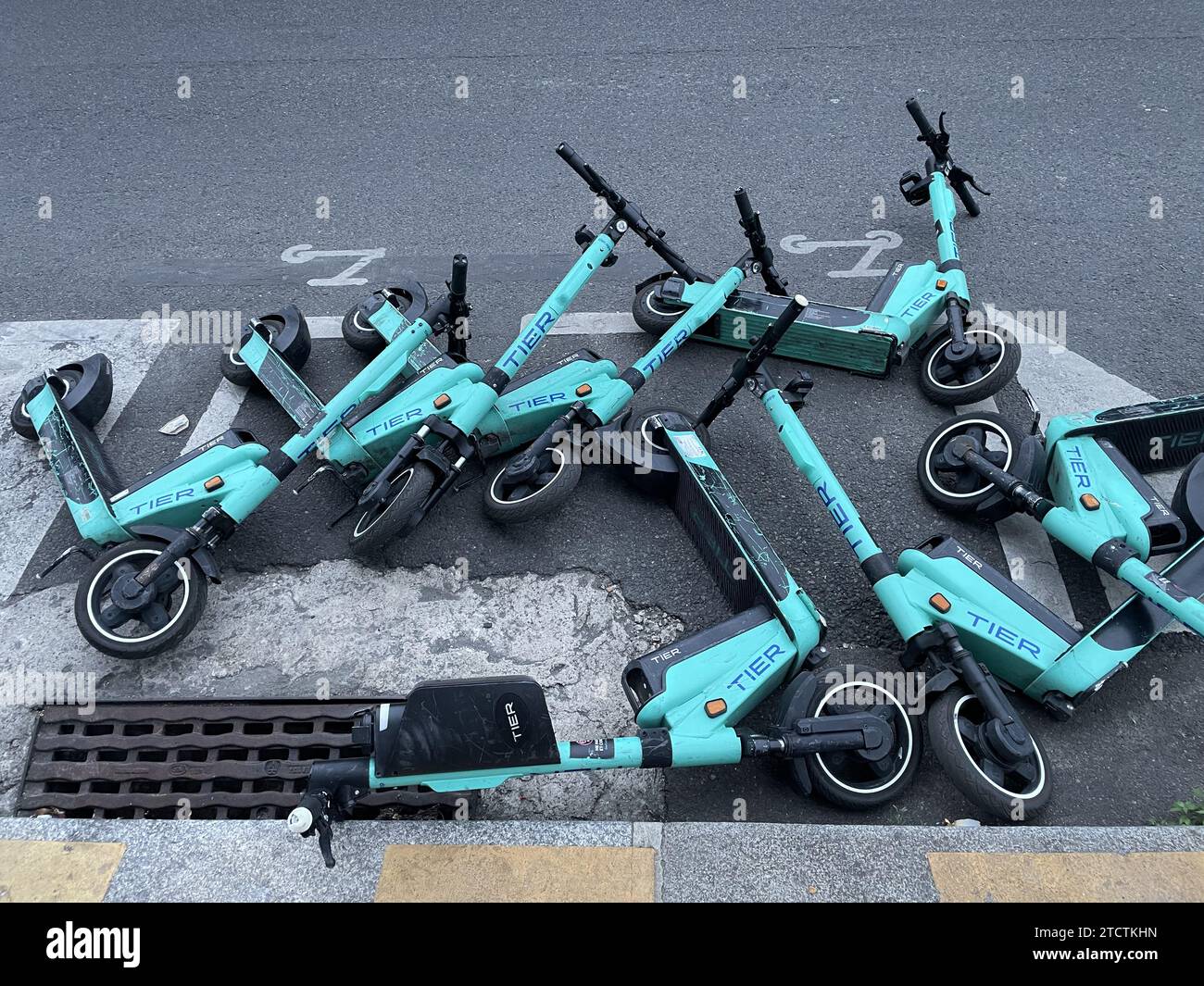 Scooters dropped on a street of Paris, France Stock Photo