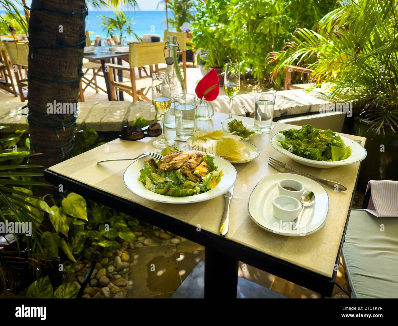 View of a lunch on a terrace by Seven Mile Beach in the Caribbean, Grand Cayman Stock Photo
