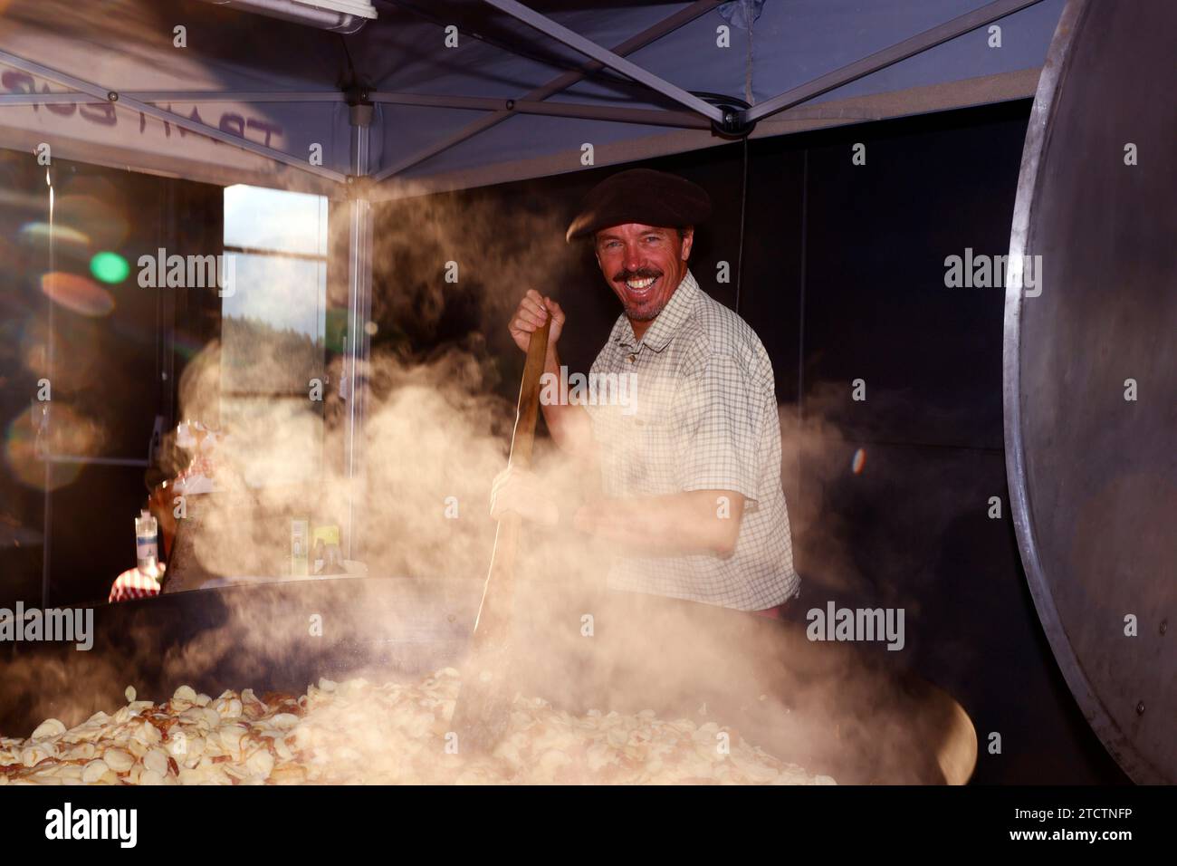 Giant fresh tartiflette, Roblochon cheese, potatoes and ham speciality in the French Alpes. France. Stock Photo