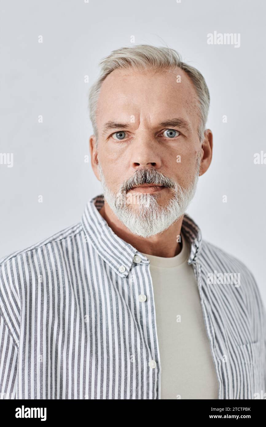 Serious Bearded Man Looking at Camera Stock Photo