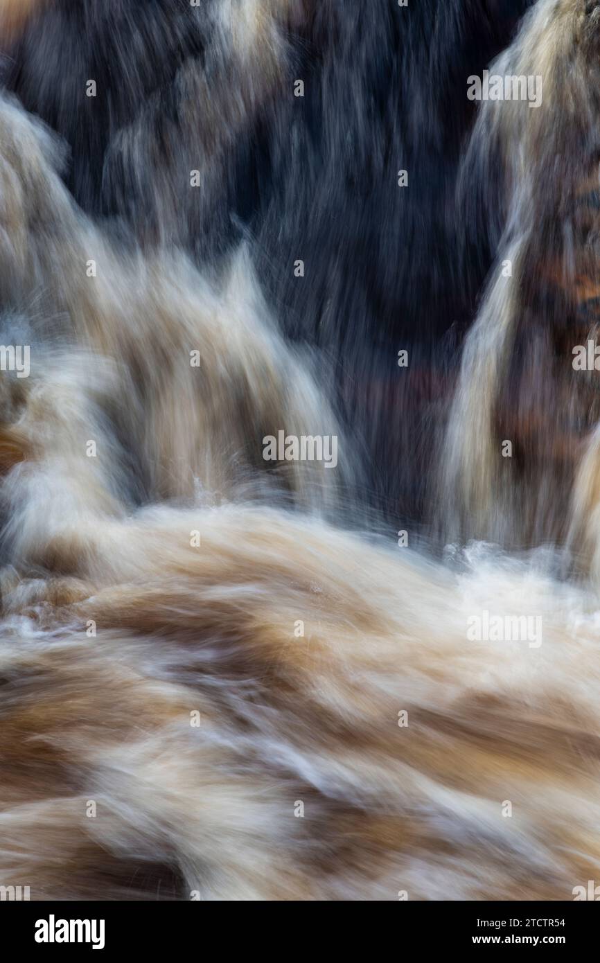 Fast flowing water over rocks. Randolf's Leap, River Findhorn, Morayshire, Scotland. Long exposure abstract Stock Photo