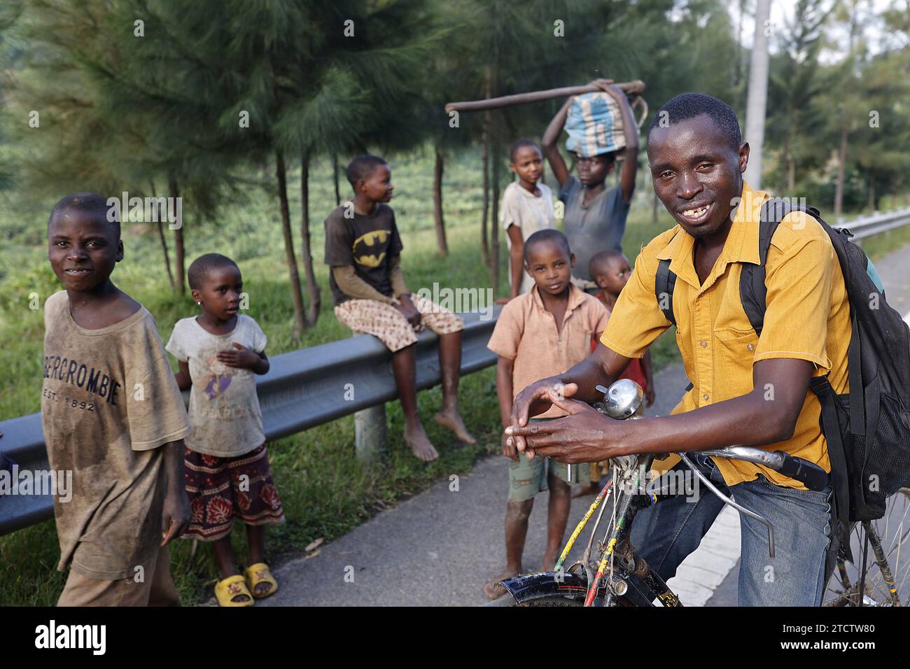 Man and children on a roadside near Karongi, Rwanda Stock Photo