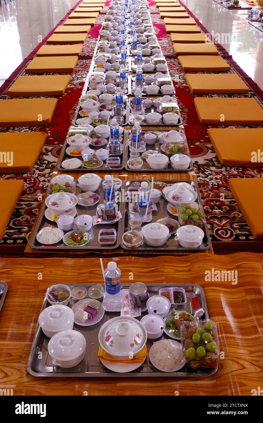 Phuoc Hue buddhist pagoda. Vegetarian meal for monks set in main hall