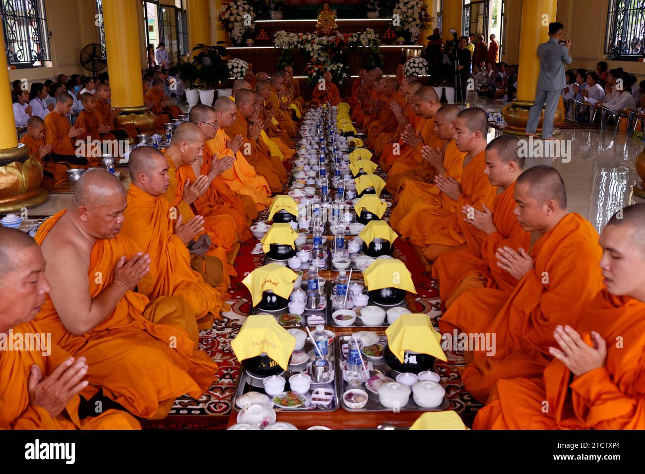 Phuoc Hue buddhist pagoda. Monks at buddhist ceremony in the main hall
