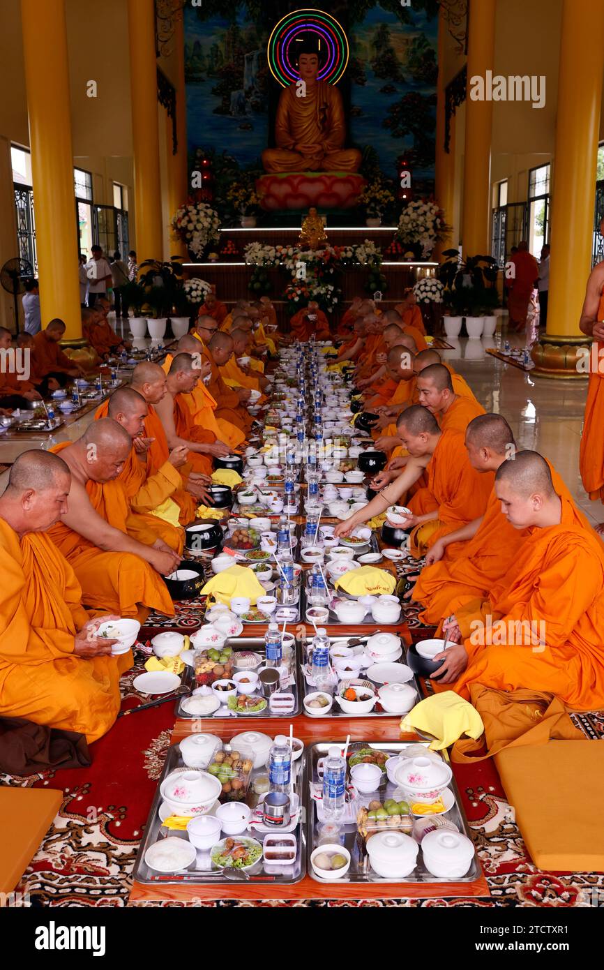 Phuoc Hue buddhist pagoda. Monks at buddhist ceremony in the main hall