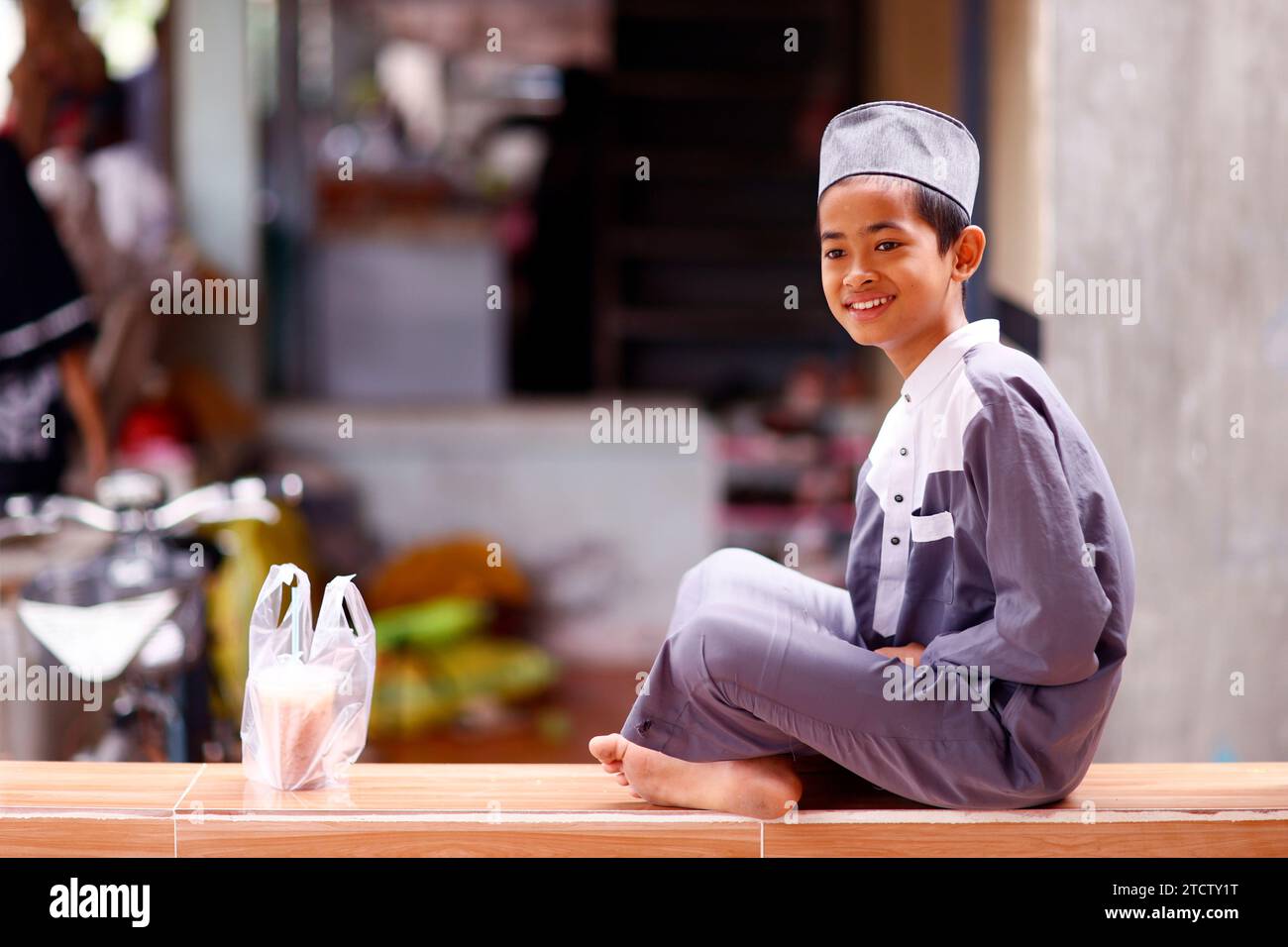Smiling muslim boy at home. Portrait.  Vietnam. Stock Photo