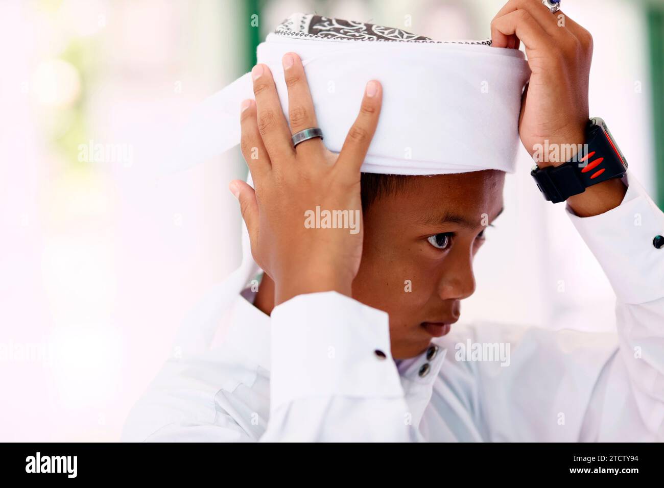Jamiul Azhar mosque. The friday prayer (salat). Young boy. Portrait.  Vietnam. Stock Photo