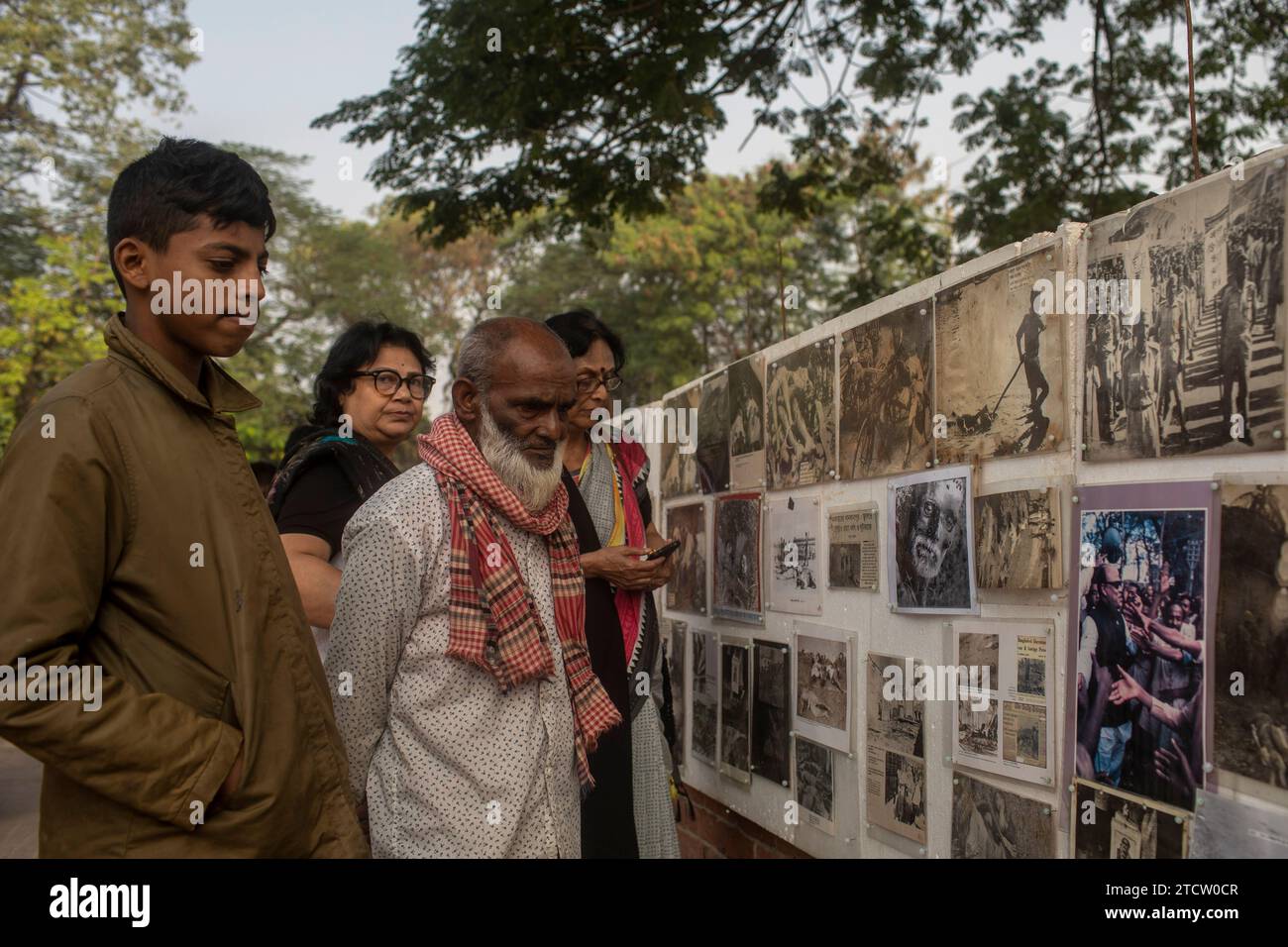 Dhaka, Bangladesh. 14th Dec, 2023. People look at the portraits of ...