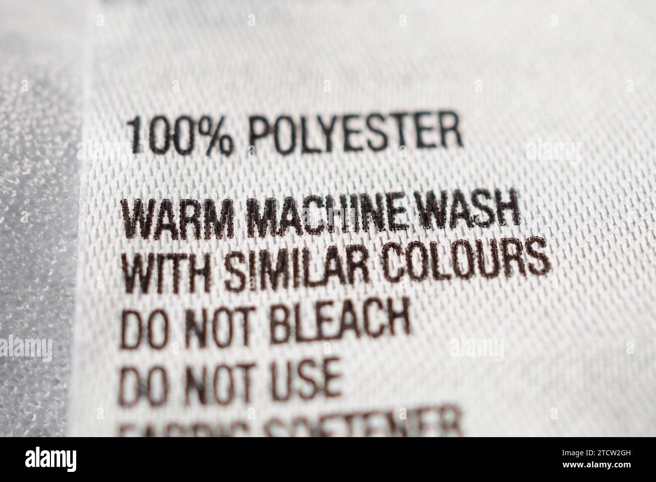 Polyester fabric Clothing label with laundry instructions Stock Photo ...