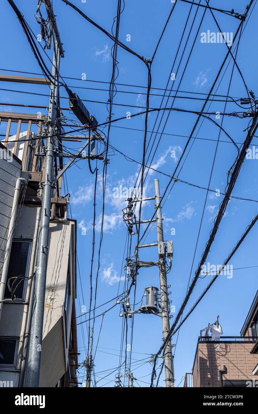 electric cables and blue sky in the city of Tokyo Stock Photo