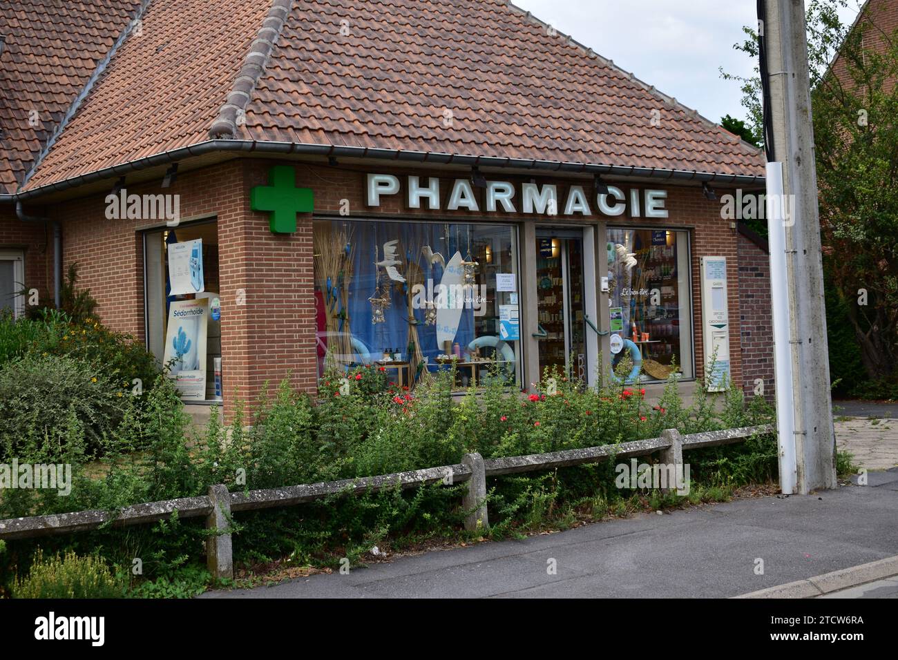 Front facade of a small pharmacy in the French village of Aniche Stock Photo