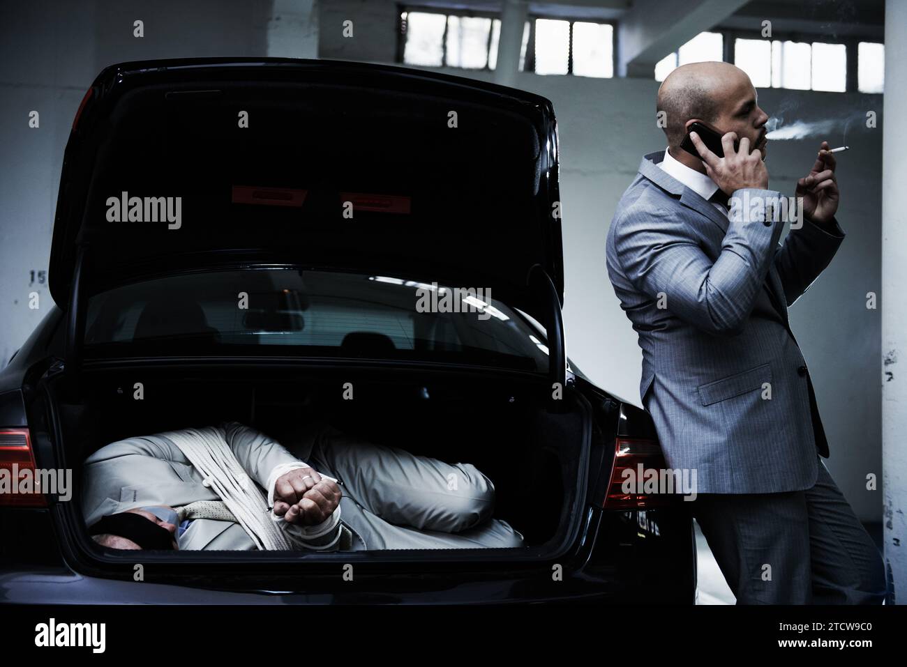 Phone call, car and gangster with hostage in trunk for negotiation
