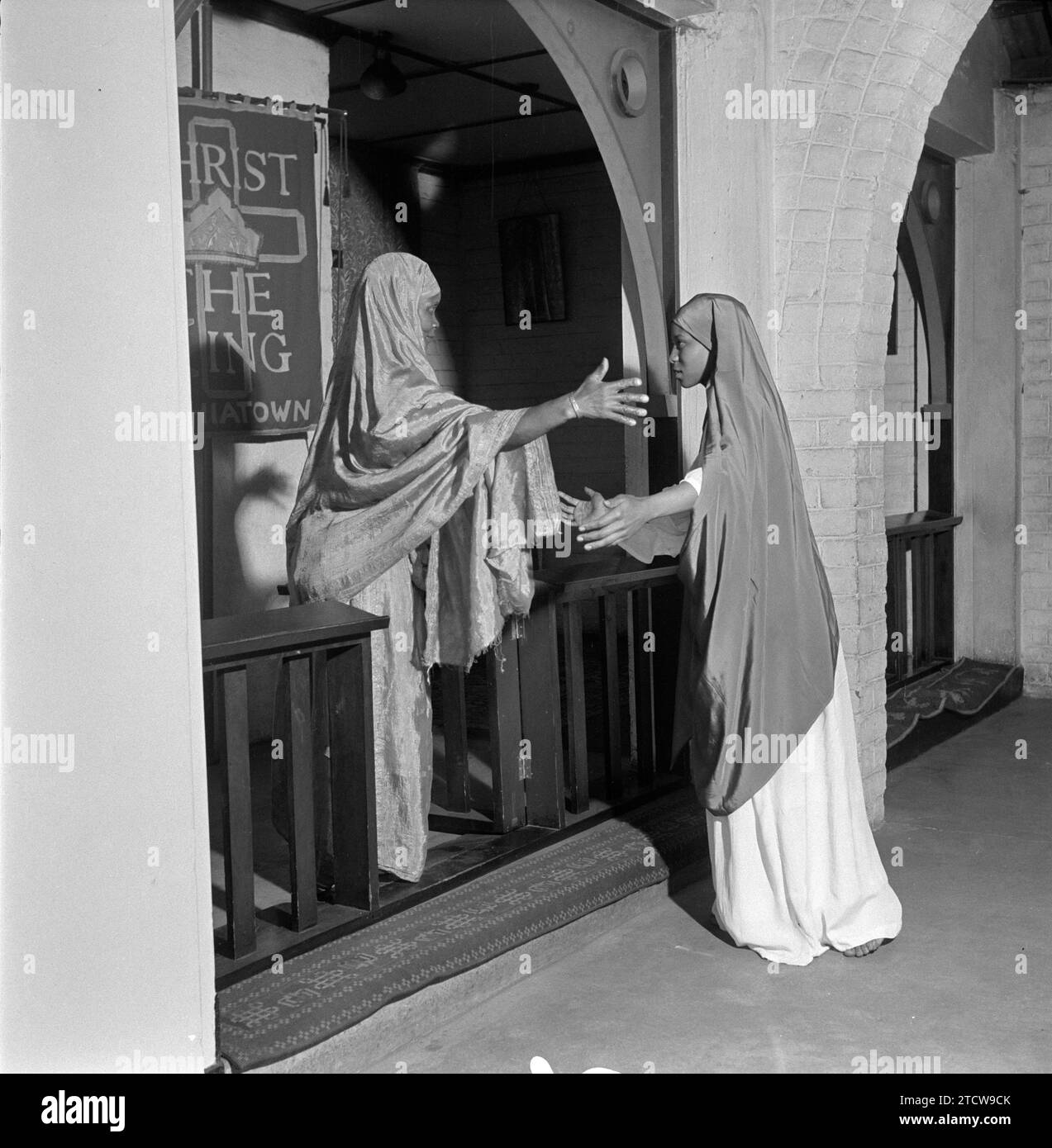 SAED:SOCIAL:RELIGION:THEATRE:DRUM JANUARY 1954 – Unto Us A Child Is Born –  “And Mary arose in those days, and entered into the house of Zacharias, and saluted Elizabeth.  And it come to pass, that Elizabeth heard in her womb, and Elizabeth was filled with the Holy Ghost..  A Christmas play is performed at the church of Christ The King, Sophiatown. (Photograph by Leon Levson ©Baileys Archives) Pix 2 NEG 364 Stock Photo