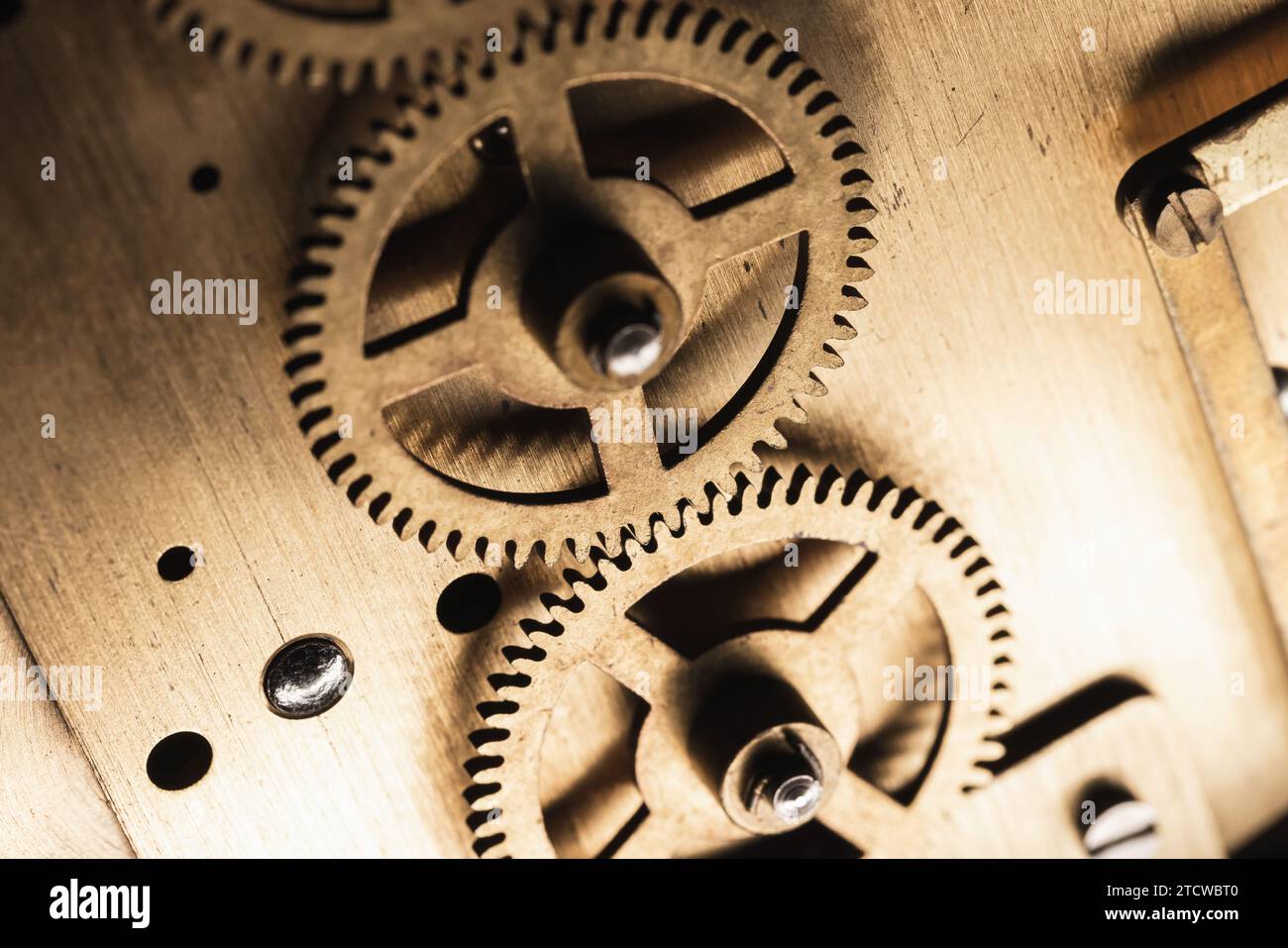 Cogwheels of a vintage table clock, close up photo with selective soft focus Stock Photo