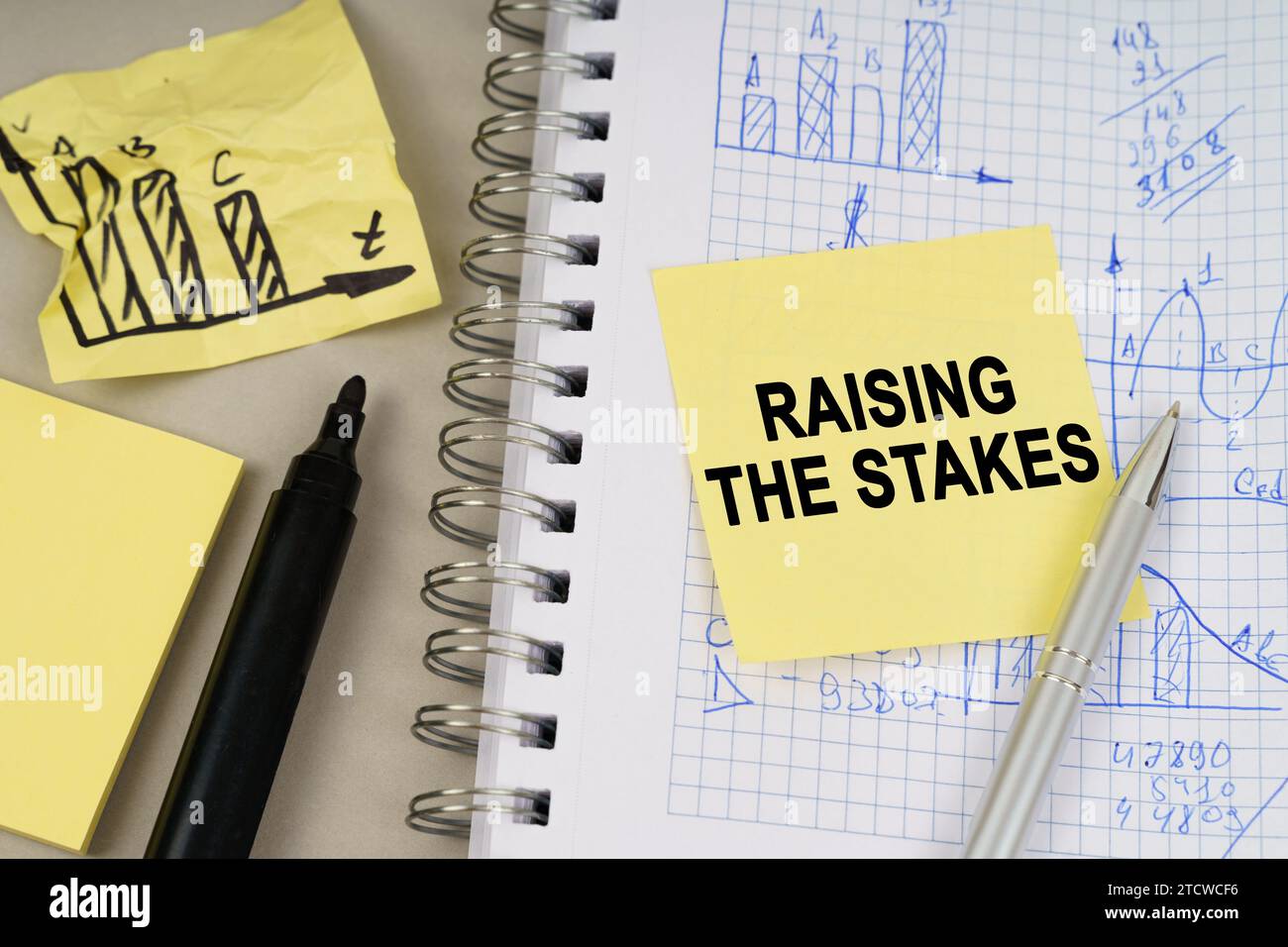 Business concept. On the table there is a notepad with notes and sticky ...