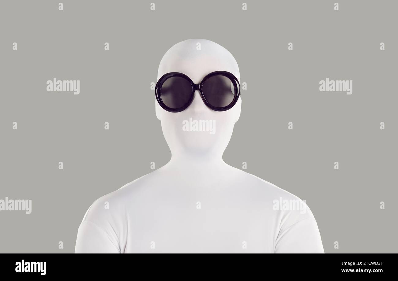 Portrait of a person disguised in a white spandex bodysuit and black round sunglasses Stock Photo