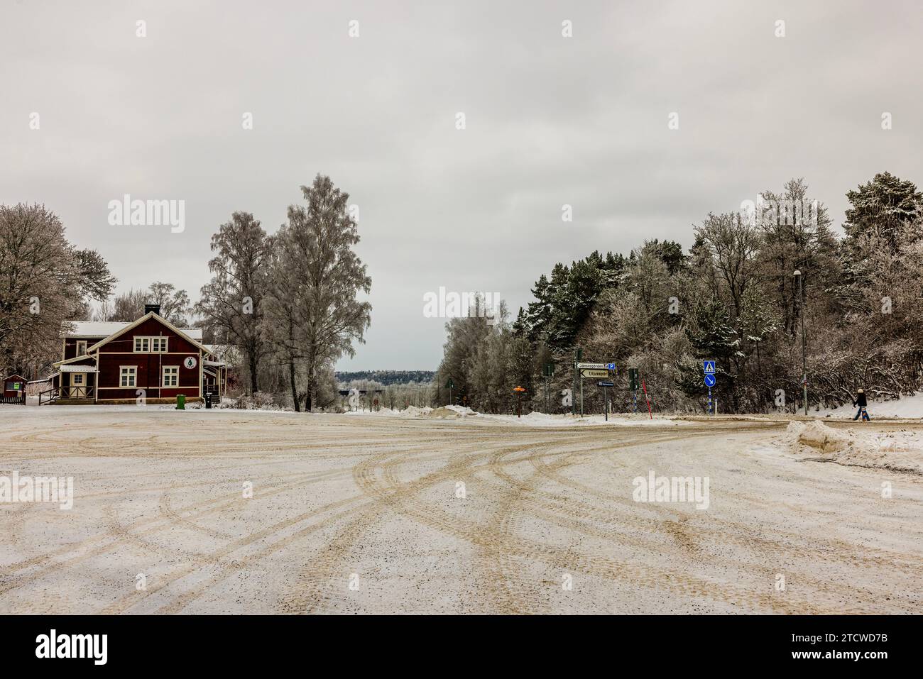 Scenic winter landscape a small town, featuring a highway, forested ...