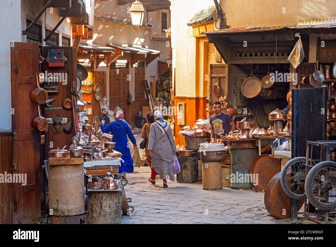 Moroccan coppersmiths’ workshops and shops on Place Seffarine, small square in medina of the city Fes / Fez, Fez-Meknes, Morocco Stock Photo